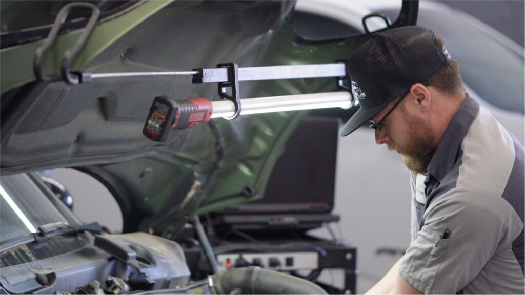 BMW iDrive warning light display showing check engine fault code at The HAUS Auto Culver City specialist